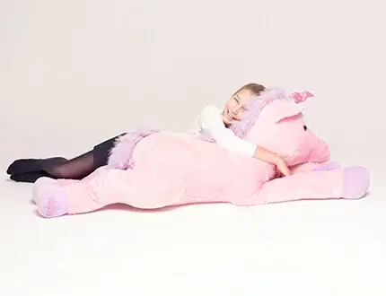 Grandi unicorni di peluche